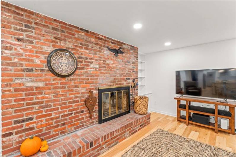 Cozy Up Next to the Brick Fireplace & Accent Wall on Those Brisk Autumn Mornings & Cool Evenings by the Fireside.