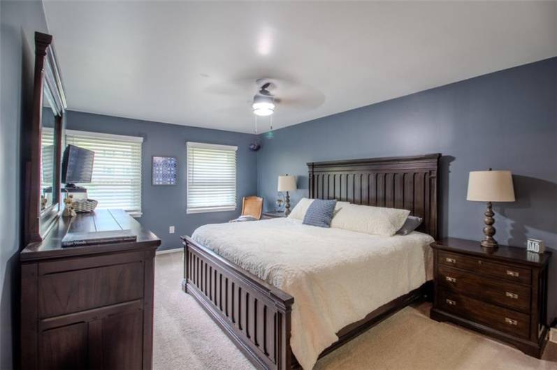 The 18x12 primary bedroom easily accommodates king size furniture and recently painted with light bright decor.