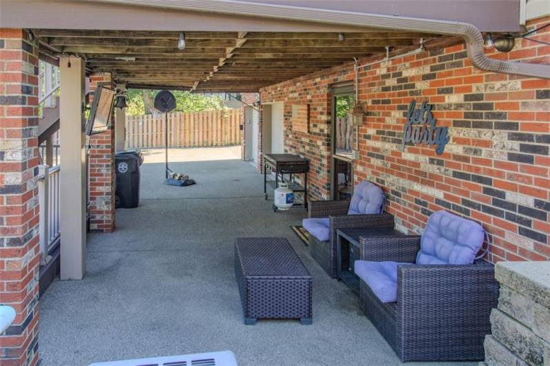 The 20x12 patio beneath the upper covered deck is a great place for poolside grilling or relaxing out of the sun and elements.