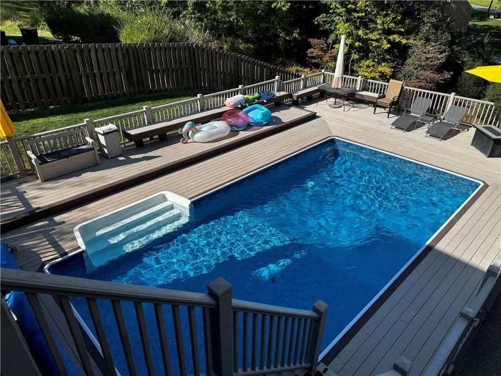 The beautiful 28x14 in ground pool has full built  in seating around the perimeter and the depth grades form 3 to 7 feet deep. The liner is 2 years old and has a solar cover,heater and sand filter.