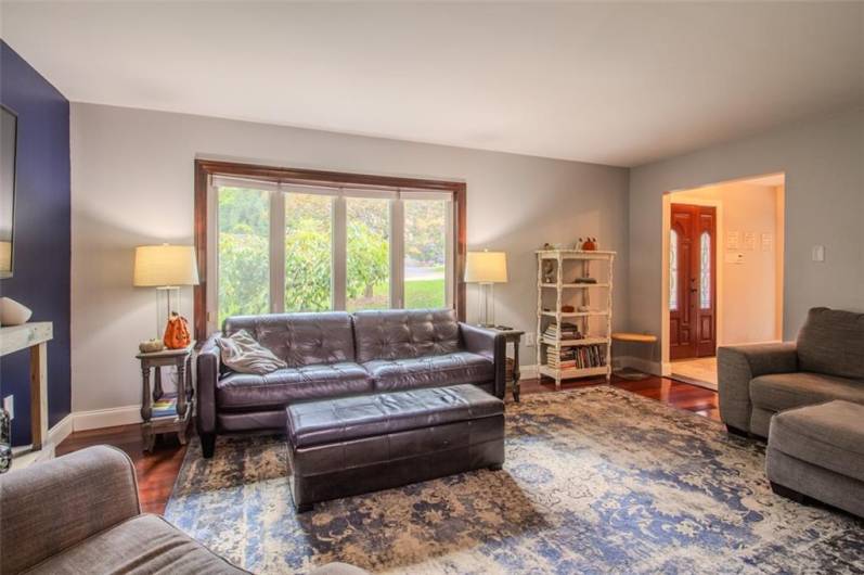 View from dining room with tons of natural lighting from the front bow window.