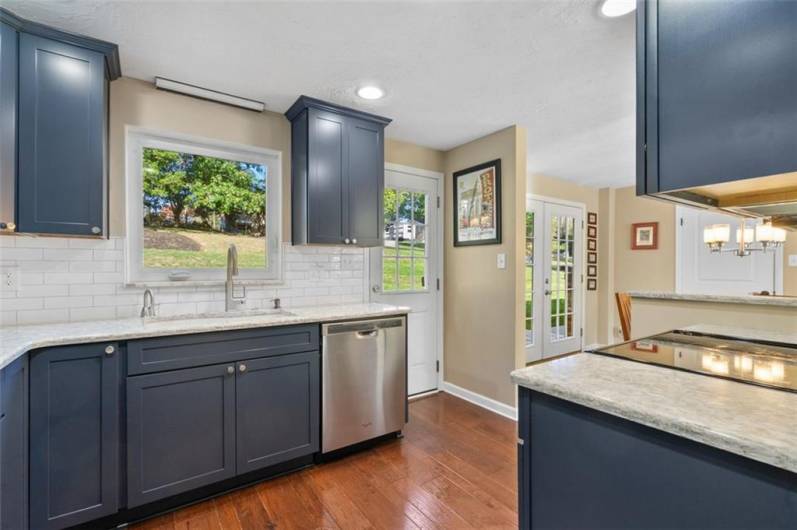 There is easy access to the custom back patio from the kitchen and also from the dining room area with the French doors!