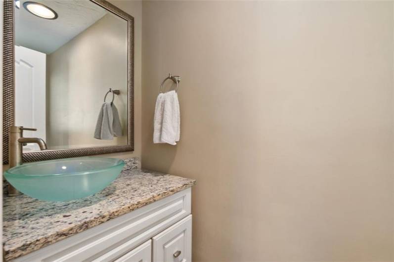 Hall wall bathroom with numerous updates...new vanity, mirror, fixtures, sink and so much more! This home has neutral colors throughout.