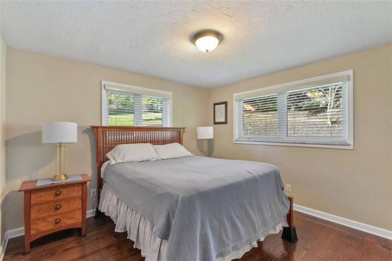 Light, bright and cheerful is this primary bedroom!