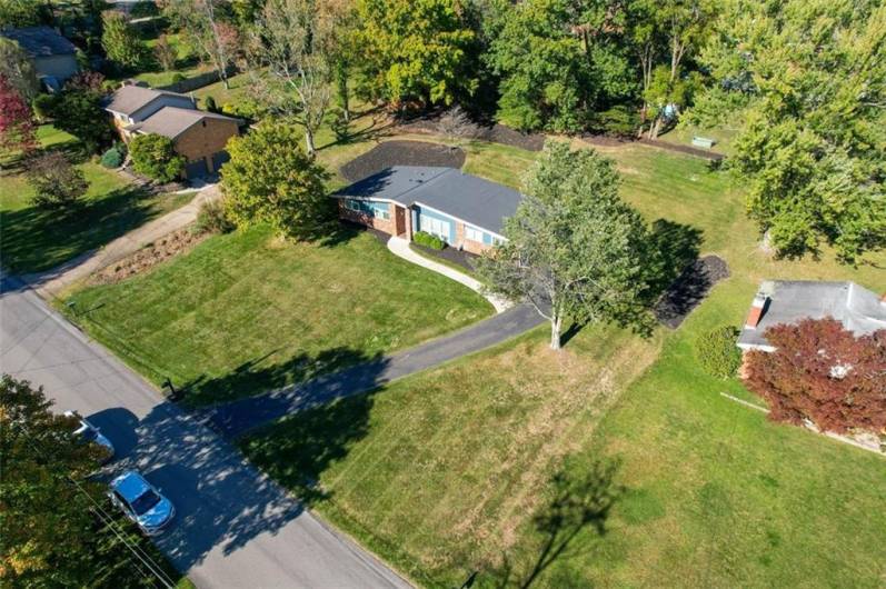 An aerial view of the home. Over .5 acres with this home.