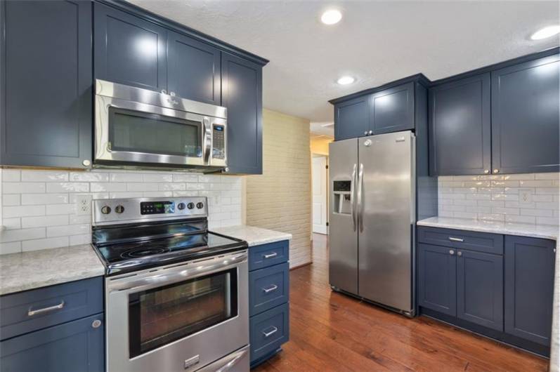 The chef/cook in your family will love this kitchen! So much counter space and the latest design.  Check out the beautiful subway tile and quartz counter tops.