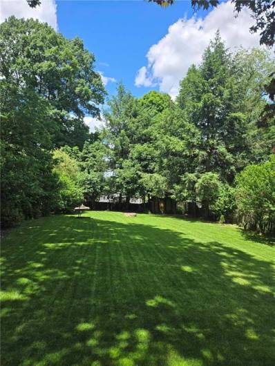 View from Deck to Level Backyard.