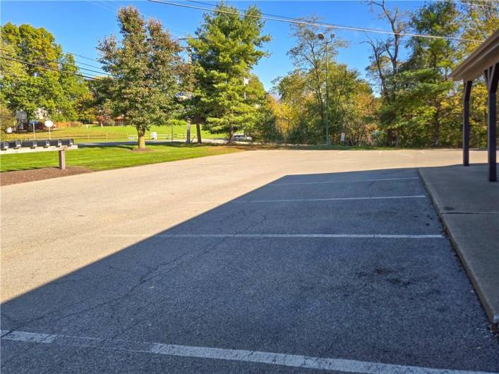 Level parking lot with over 50 spaces.