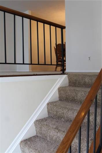 Wrought iron & wood railing- New carpeting & freshly painted interior greet you at the front Entryway