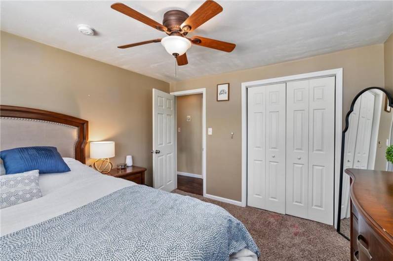 Double door master bedroom closet with built in organizer.