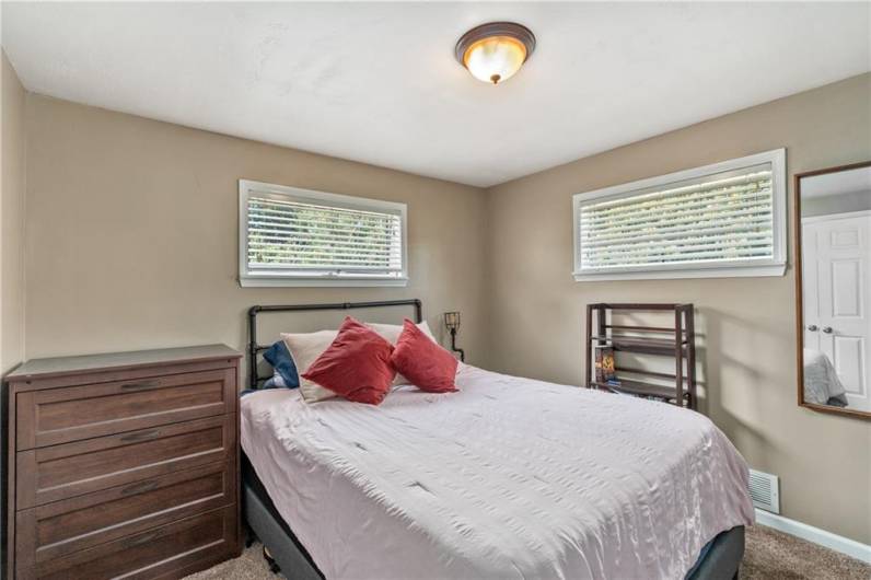 Second bedroom with overhead lighting and ample sized closet.