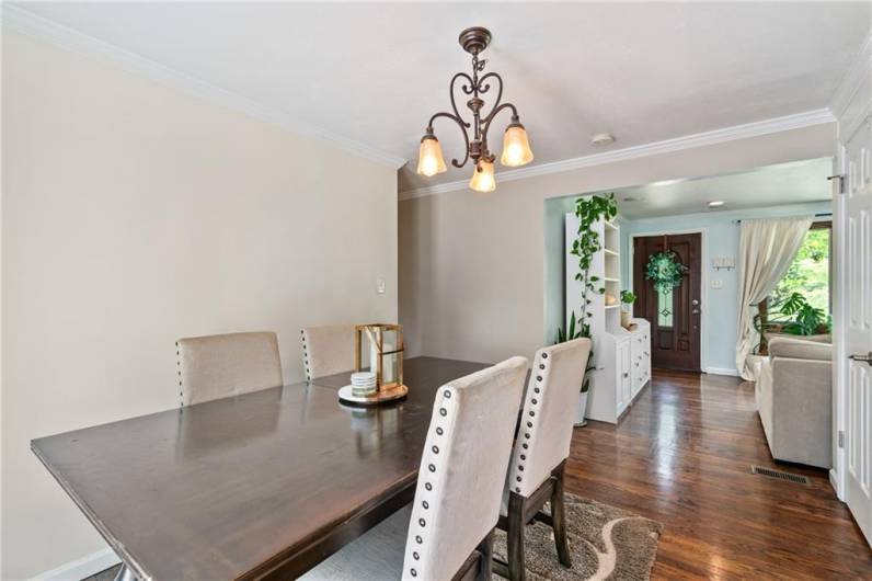 Crown molding in dining room and updated light fixtures throughout home.