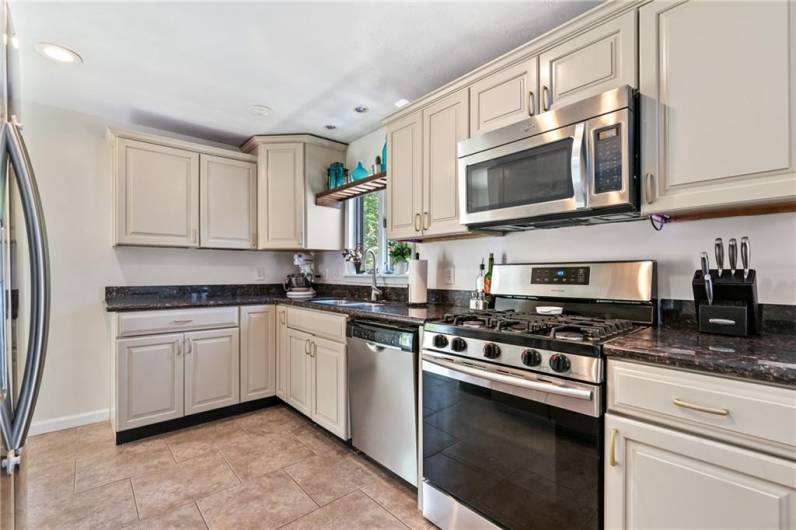 Kitchen has been updated with Kraftsmaid soft close cabinets and drawers with pull out shelving.