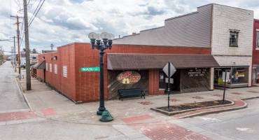 PUB AND GRILLE LOCATED ON MAIN ST. BRICK EXTERIOR 13000 DAILY TRAFFIC COUNT