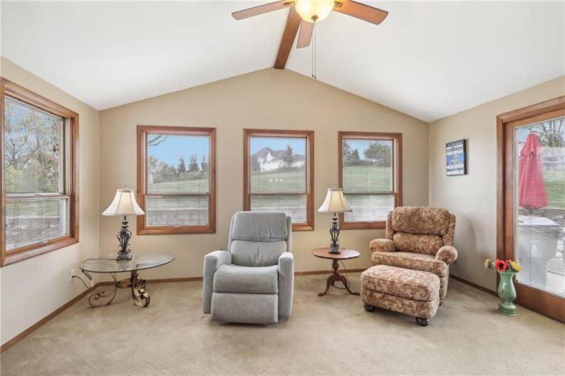 The sunroom, located off the back of the dining room can double a den.