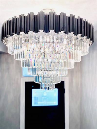 This image showcases an elegant, architectural lighting fixture with a sophisticated ambiance.