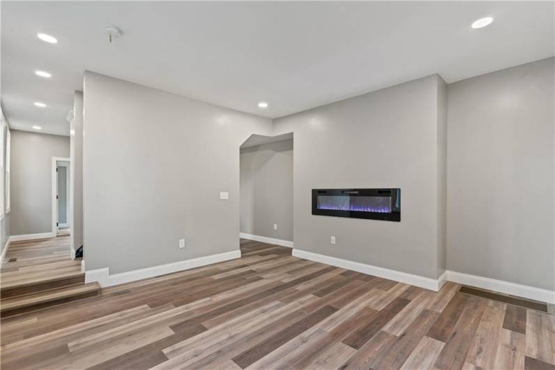 This listing features a spacious layout, beautiful hardwood flooring, and recessed lighting throughout.