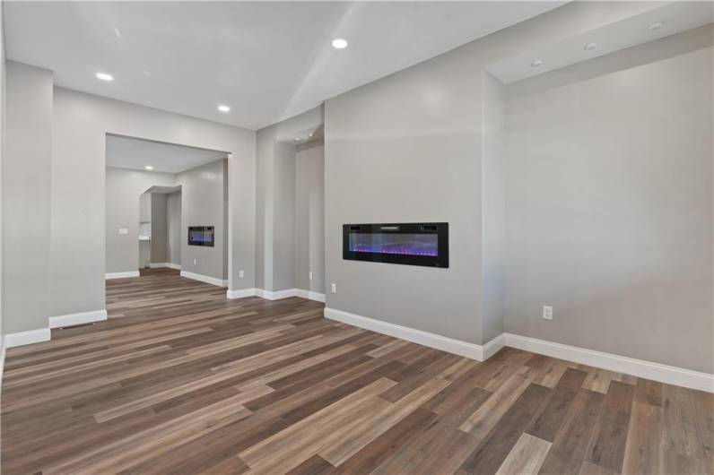 This listing features a spacious layout, beautiful hardwood flooring, and recessed lighting throughout.