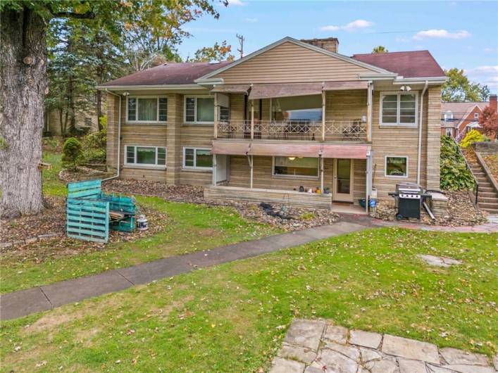 Enjoy Outdoor Living and Entertaining from Covered Deck & Patio overlooking mostly private big backyard!Stunning Stone Sprawling Level Entry Ranch