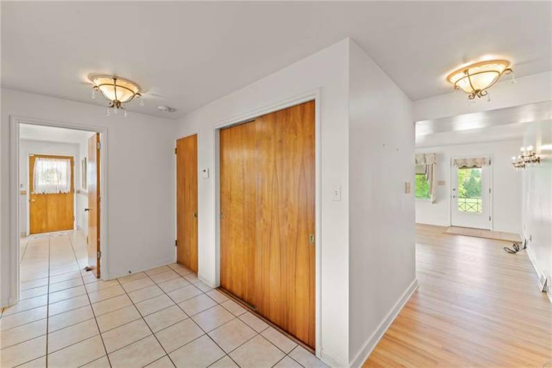 Another View of Spacious & Bright Front Entrance w/ HUGE Double Sliding Door Coat Closet ~ SO MUCH STORAGE throughout entire home! Unique Antique Style Light Fixtures adorned with Gemstone Crystals Dangling Elegantly