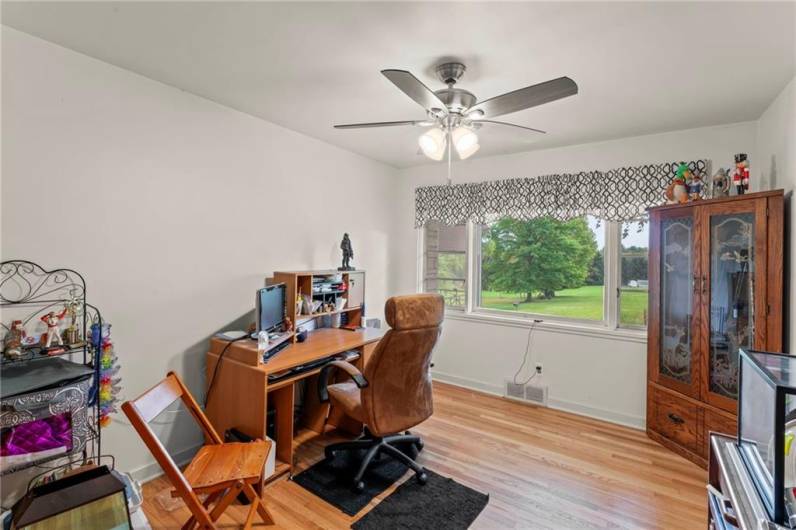 Spacious 12x12 Bedroom currently used as an office continues with Style of Home offering a Nice Big Window bringing in Nature's Beauty, Ceiling Fan Light, Original Hardwood Floors, Plaster Walls & nice sized closet w/ light!