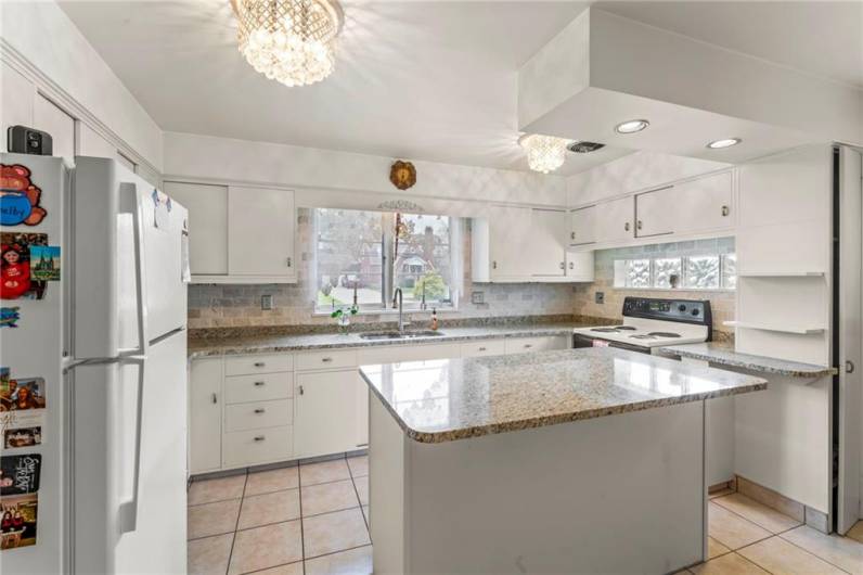 Another View of Spacious Eat-in Kitchen offering plenty of Room for all the Family Chefs to assist in meal preparations enhanced by double window creating a Bright Ambiance for all to Enjoy! Hello Morning Coffee!