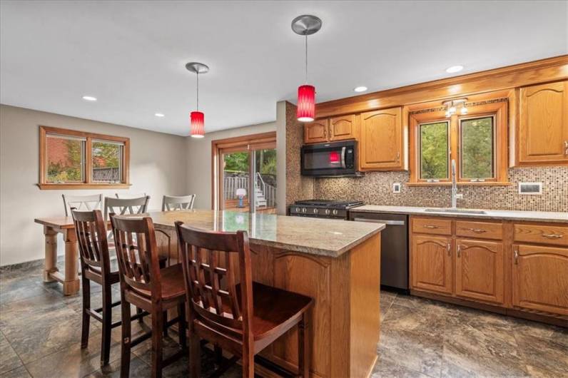 Kitchen with island and adjoining eat in area