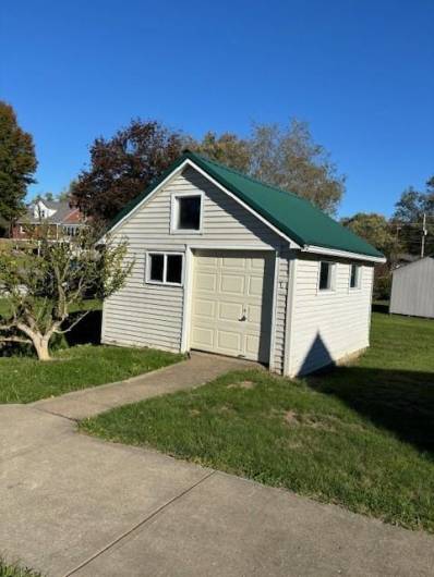 Storage shed for lawn equipment and workshop