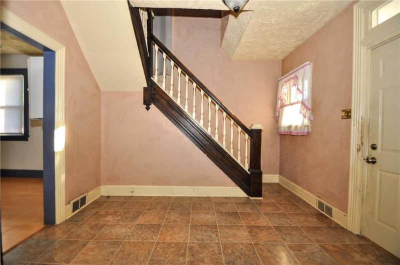 Another view of the entryway, I thought you could possibly add a half bath right by the stairs, this area is huge