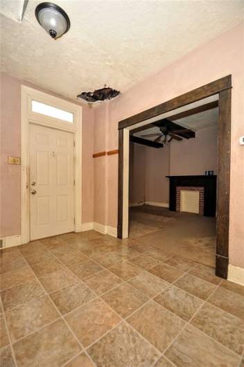 This view shows where the upstairs bath had leaked into the entryway, plumbing was repaired but the ceiling wasn't