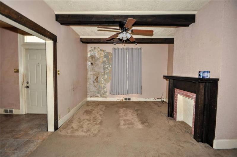 Another view of the living room, this shows the wall where the gutters had leaked, the gutters were repaired but the wall needs fixed.