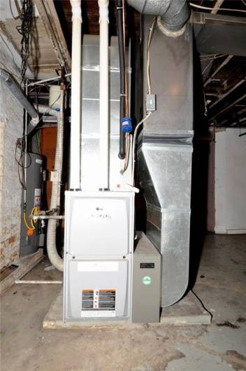 The furnace.  There is central ac on the main level of the home, there is no ductwork to the second floor so you need to use window ac.