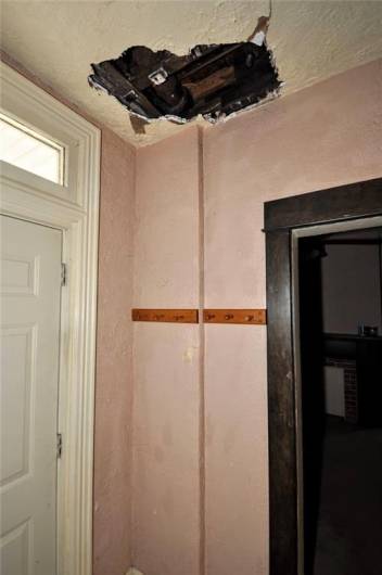 The entryway repair that needs made.  The plumbing was fixed, the ceiling still needs repaired