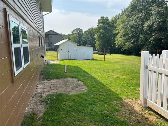 Home to left, pool to right, storage shed straight ahead!