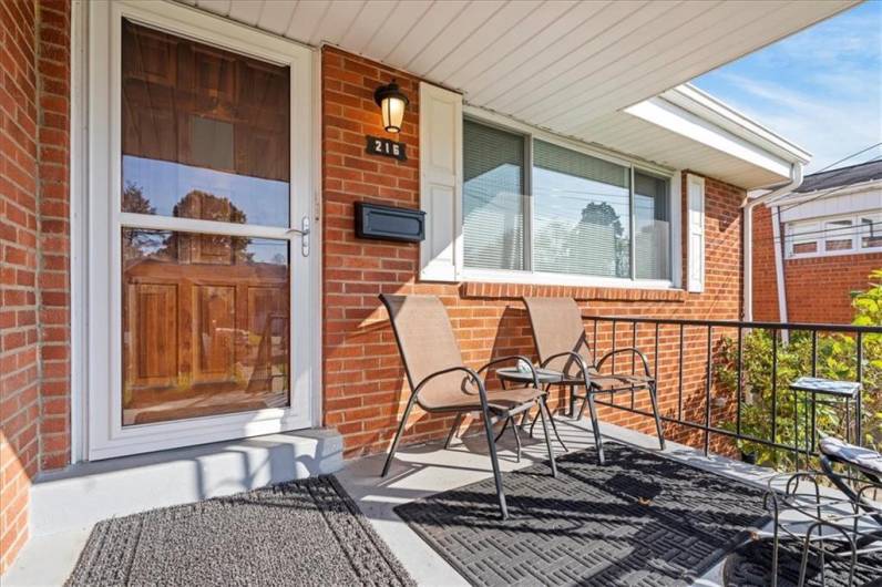 This covered front porch is welcoming and a great place to enjoy the weather