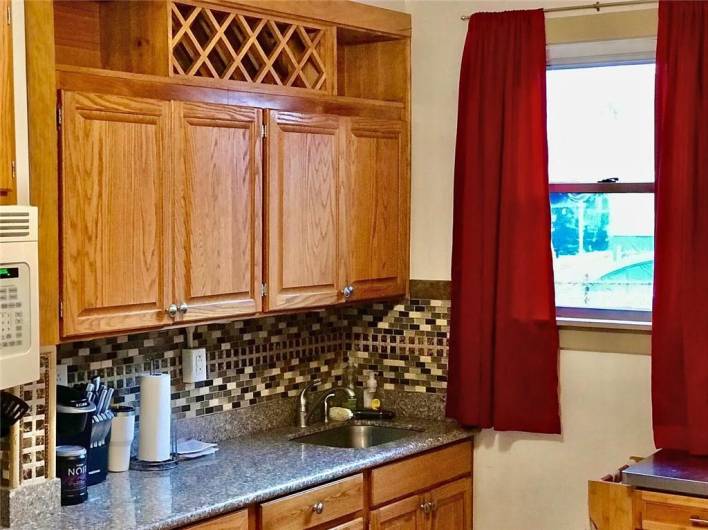 1st floor Kitchen window facing East Side back of home right off private outdoor patio.