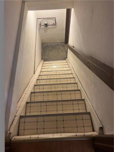 Steps heading to garage and laundry area.