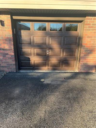 New garage door opener and extra parking paved parking space.