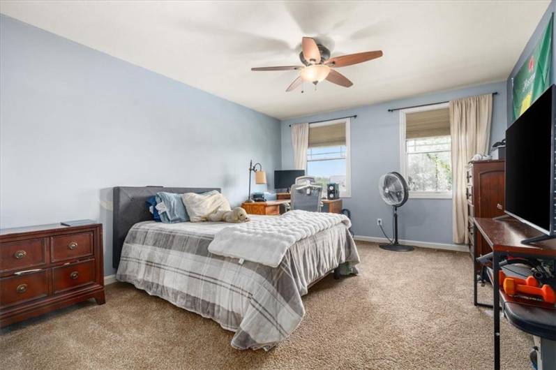 2nd bedroom on upper level. Wall to wall carpeting and two large windows.