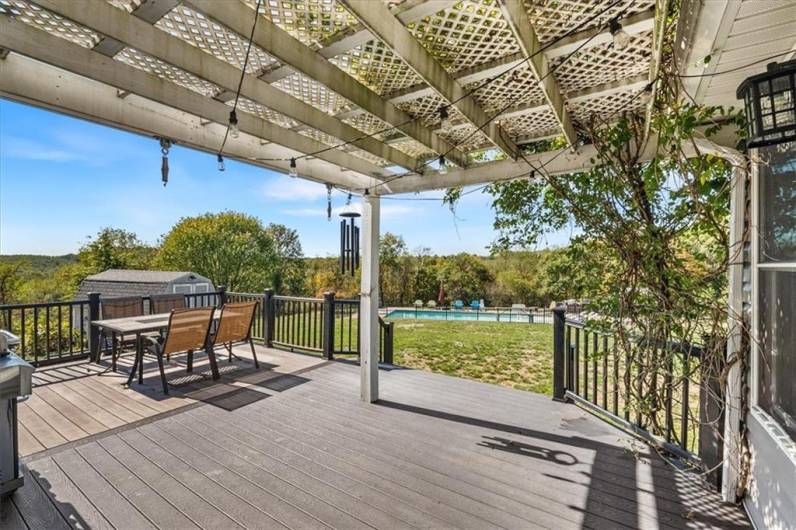 Partially covered deck off the sunroom