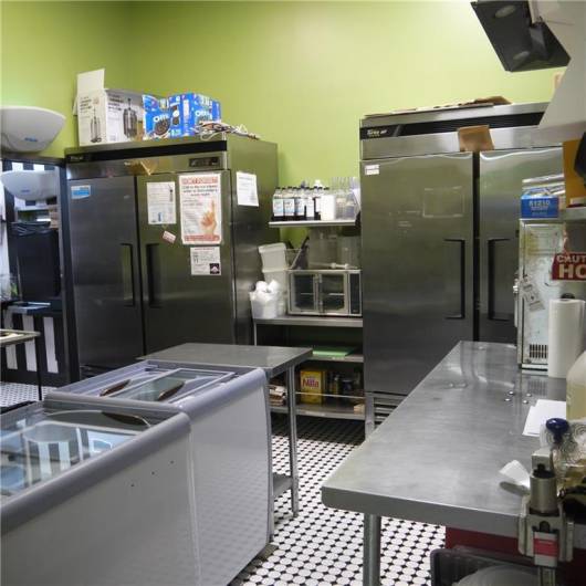 BACK ROOM WITH ICE CREAM FREEZERS, REFRIGERATORS, COOKING AREA & MORE