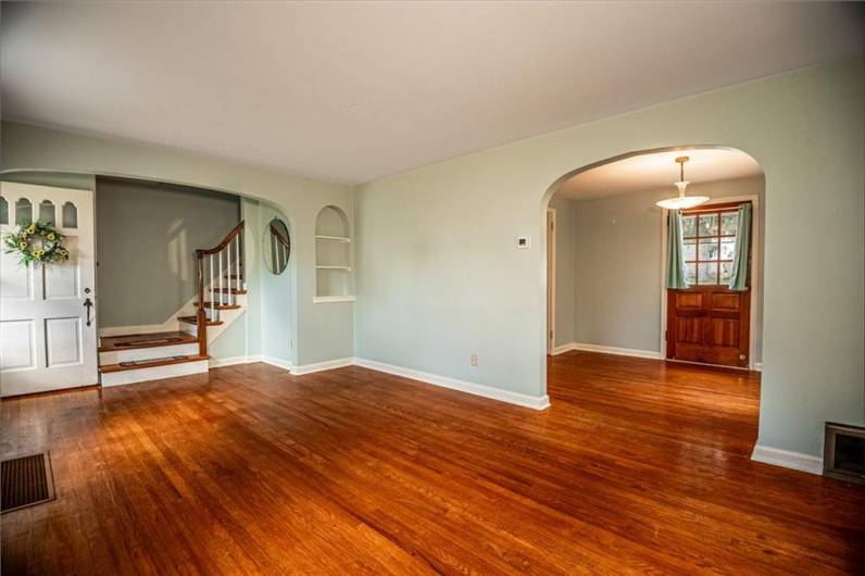 Living Room, views to stairway, and view to Dining Room and back door