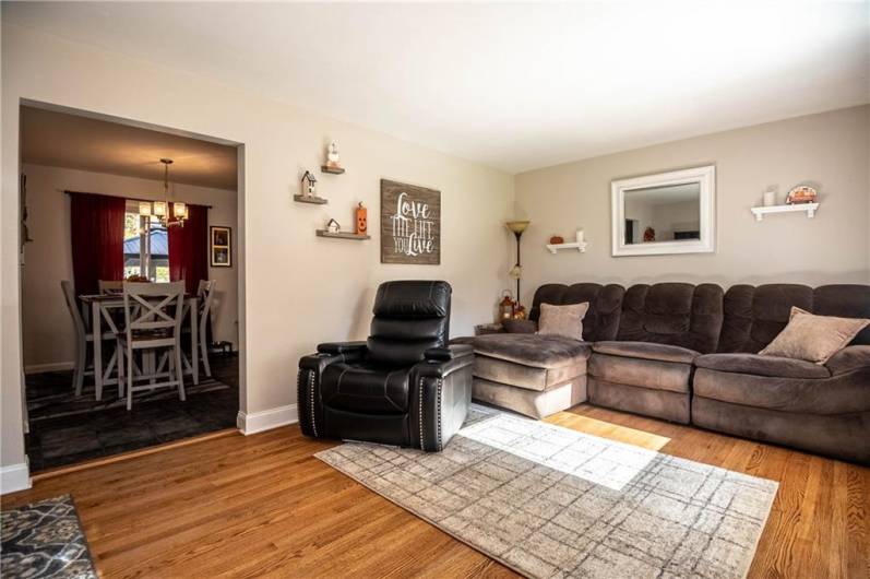 Cozy living room with plenty of natural light shining through!