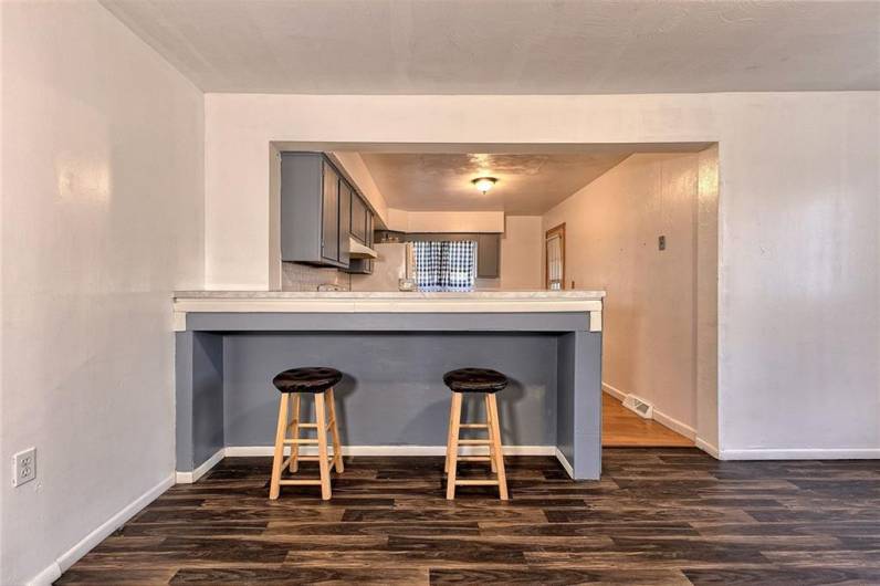 The dining room flows nicely into the kitchen with counter area.