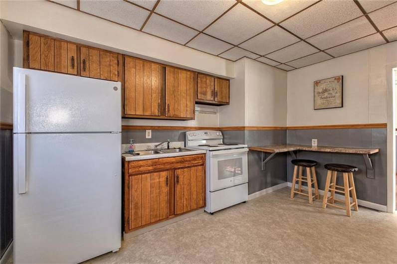 The kitchen of the one bedroom has counter space for eating.