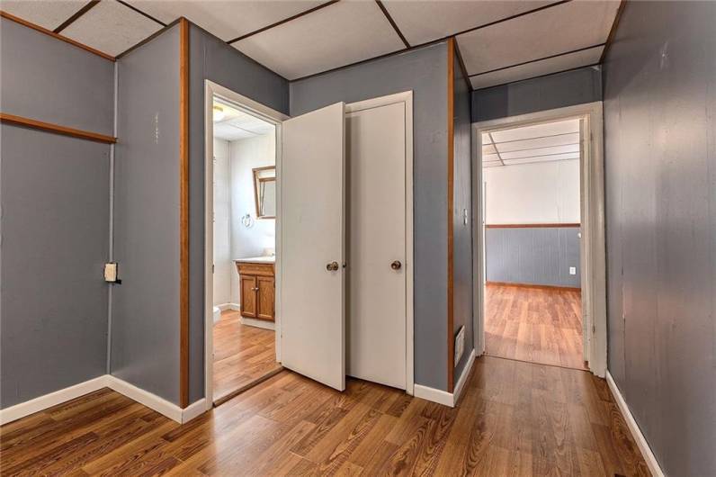 Vinyl tile flooring runs from the bedroom to the living room.