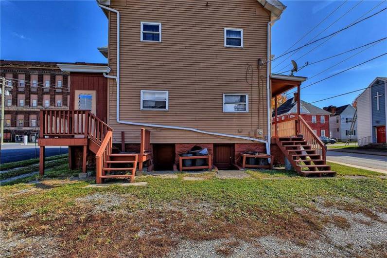 This triplex has its own parking lot for tenants.