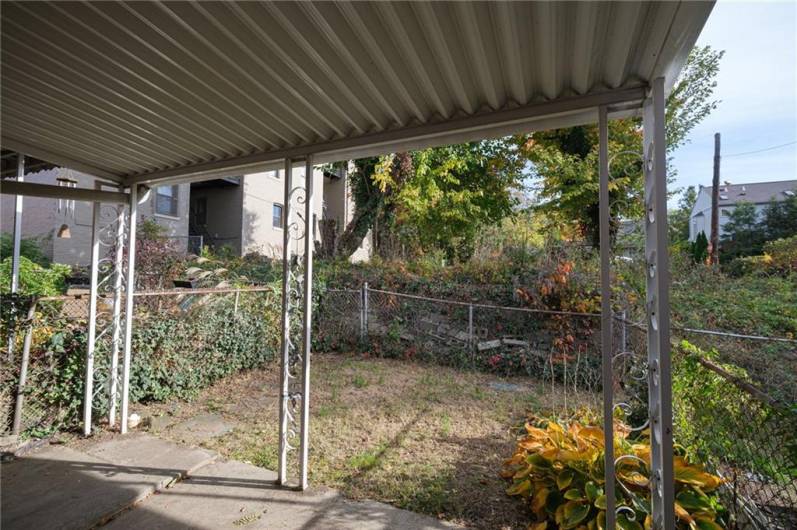 Yard is small but has fence all around.