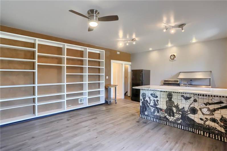 Beautiful open kitchen with an art installation island created by commissioned artist Laura Jean McLaughlin.