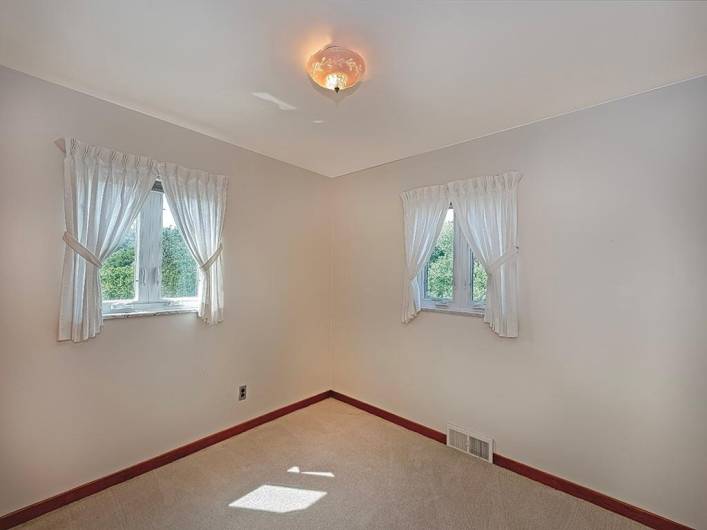 Another view of bedroom 3, hardwood floors under the carpet.